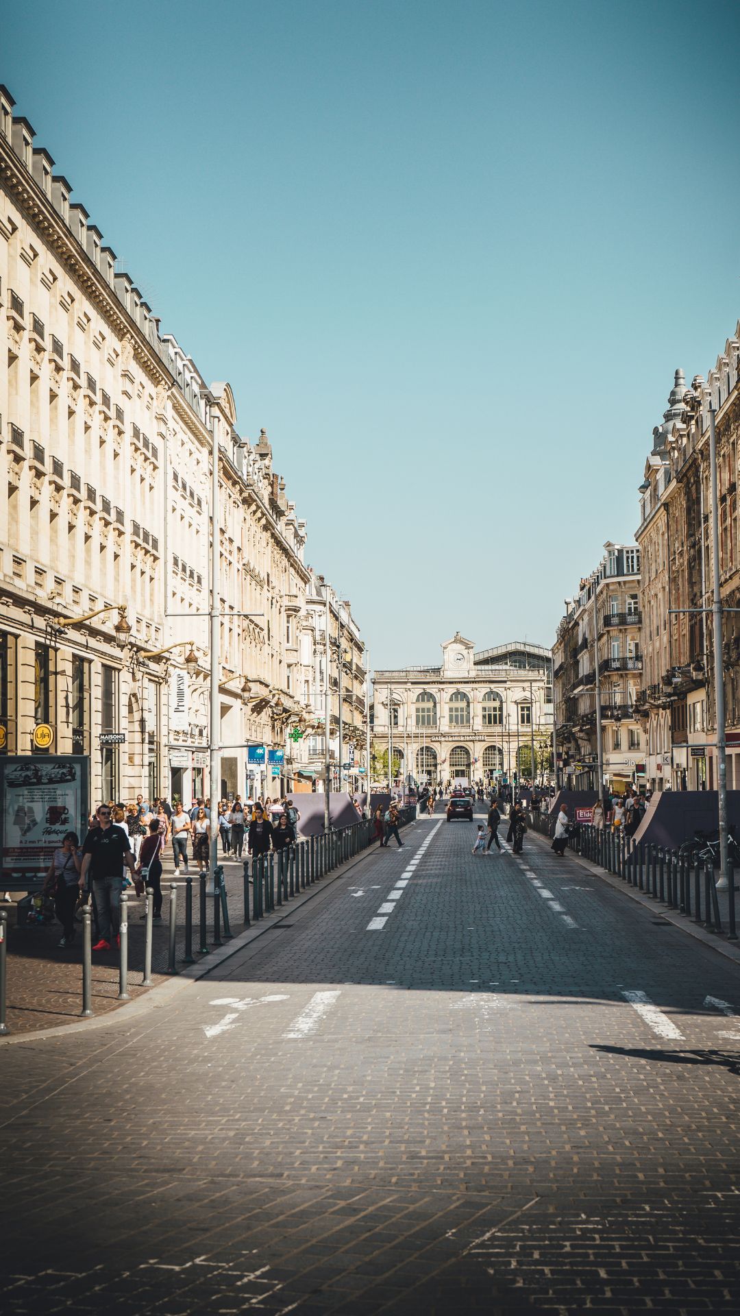 Empty gorgeous street in Copenhagen featuring beautiful architecture lining both sides, showcasing the charm of business travel in the city