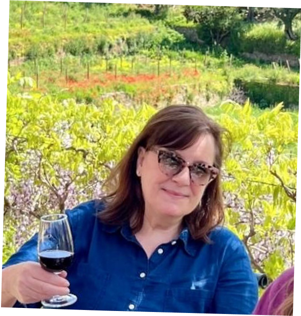 Sequel Travel agent Maryneil enjoying a glass of red wine at a vinyard in Spain