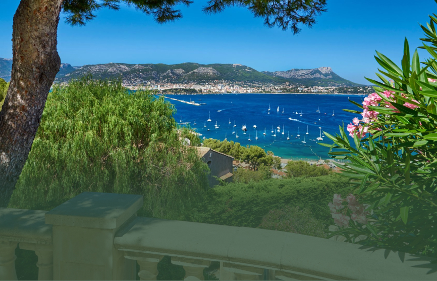 Provence vacation destination featuring a view from a tropical backyard overlooking the blue ocean water 