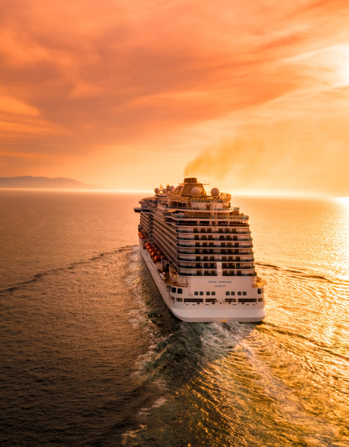 Vacation travelers enjoying a sunset cruise during a beautiful sunset 