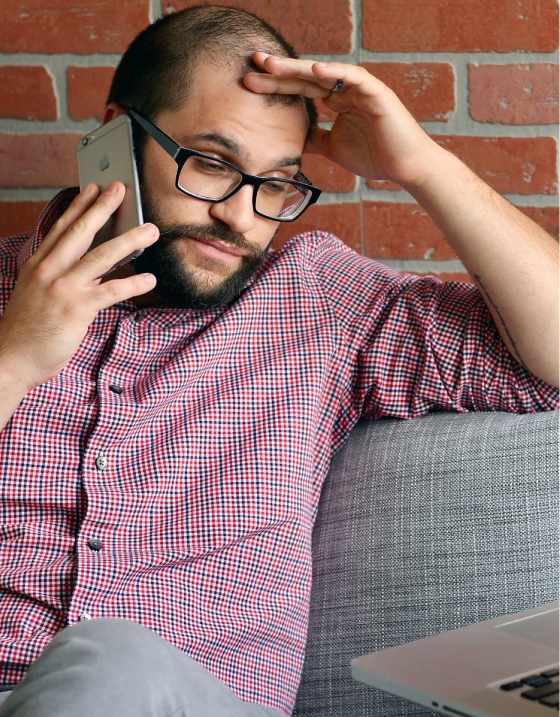 man looking a little frustrated on his cell phone